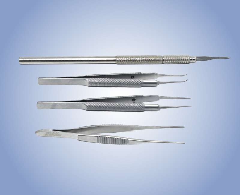  a set of surgical tools, primarily sewing forceps. These delicate instruments are essential for precise handling of tissue during surgical procedures.