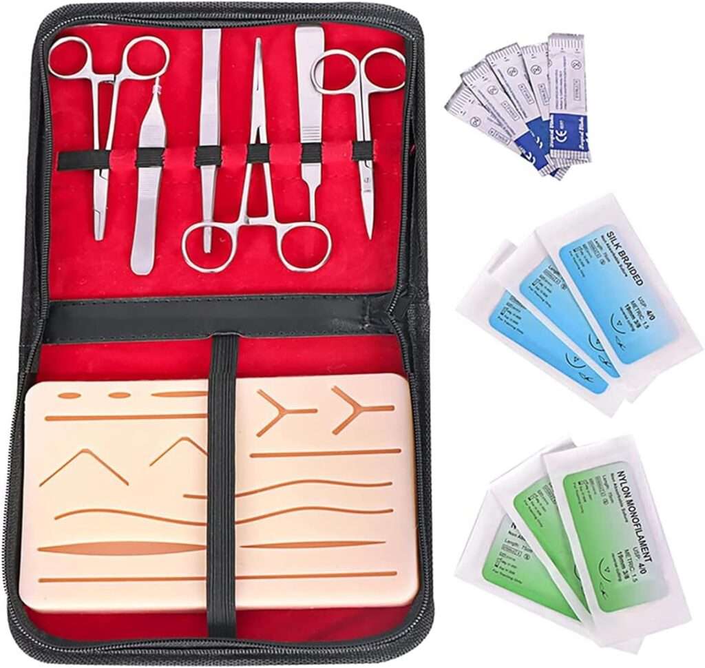 Suture practice sheet laid out with needles and sutures, showcasing an educational training setup