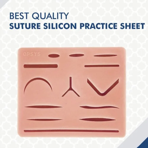 Close-up of a silicone suture practice sheet featuring various markings for suturing techniques.